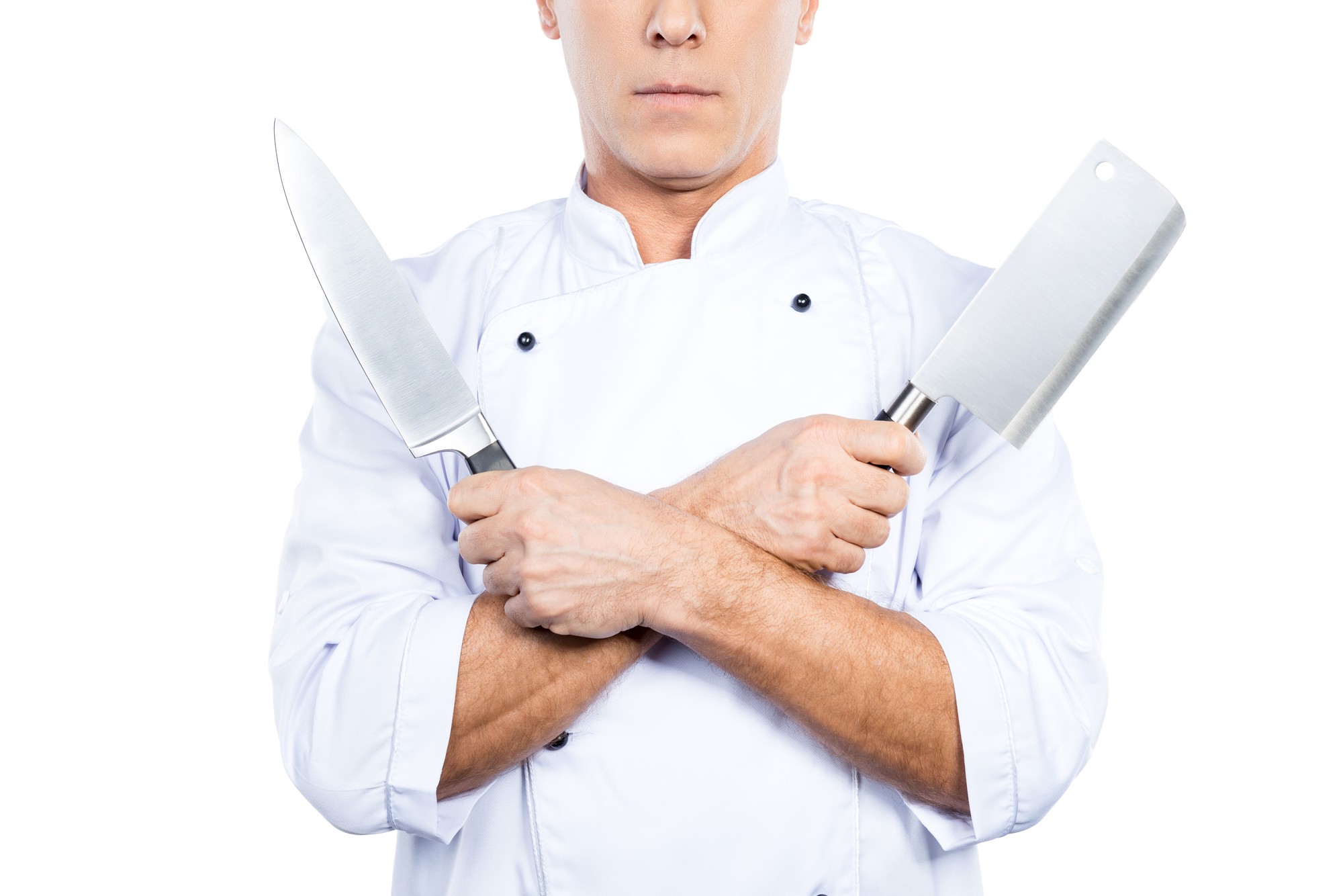 Chef demonstrating knife technique to students
